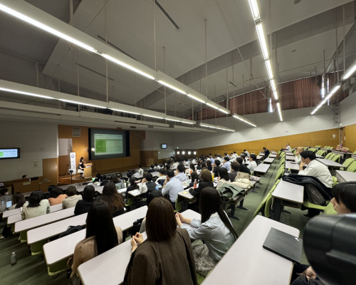 Kaizen BPO practices showcased as attendees engage in a lecture on improvement strategies.