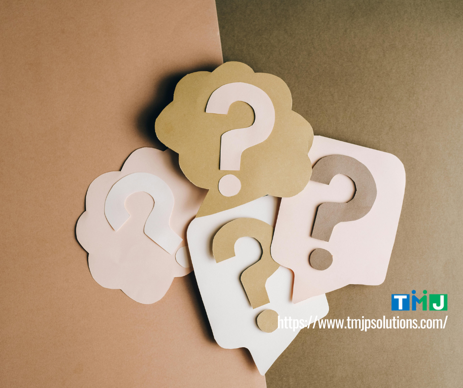 Paper cutouts shaped like speech bubbles and clouds with question marks, symbolizing workplace miscommunication and the hidden costs of unclear communication.