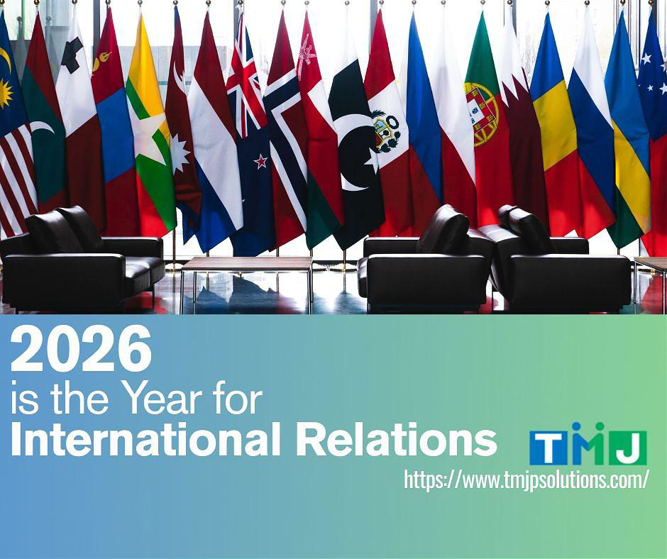 Row of national flags in formal meeting space with TMJP international relations announcement.