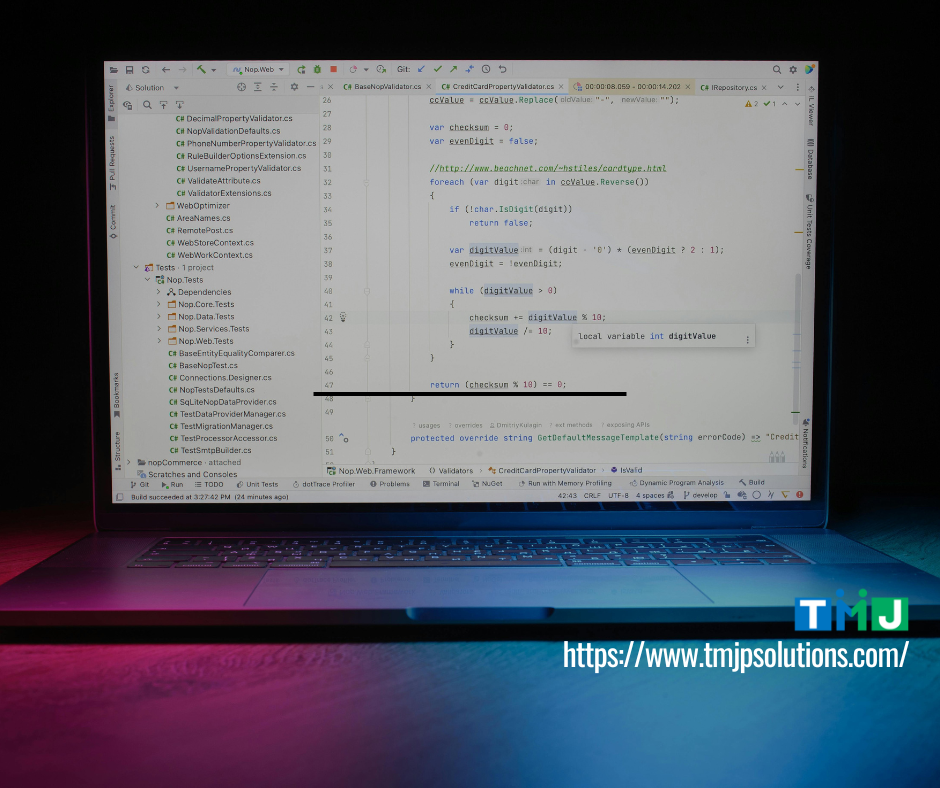 Laptop screen showing C# code for credit card validation, symbolizing TMJP’s streamlined approach to compliance and secure digital solutions.
