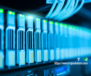 Close-up of a secure server rack with active storage drives and network cables, symbolizing TMJP’s ISO 27001-certified digital infrastructure.