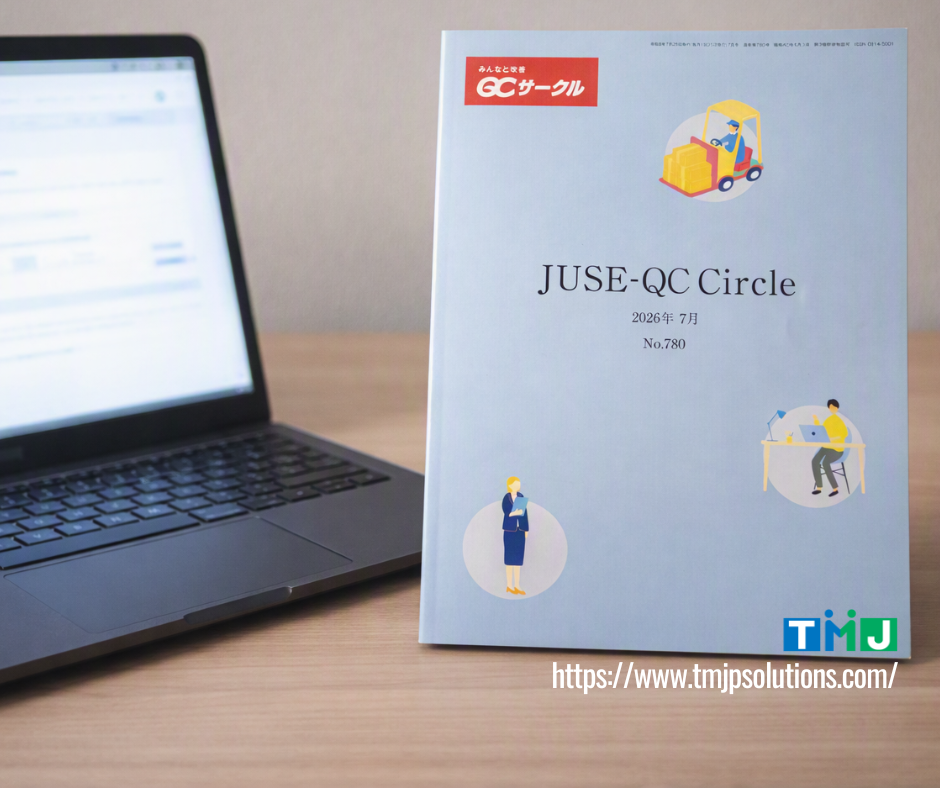 Light blue JUSE-QC Circle magazine placed on a wooden desk beside an open laptop, featuring illustrations of workers and TMJP’s logo, highlighting TMJP’s QC Circle activities in the July 2026 issue.